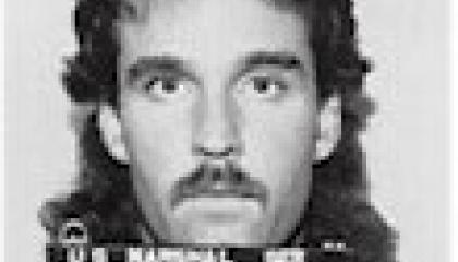 Face photo of male fugitive Enrique Enriguez