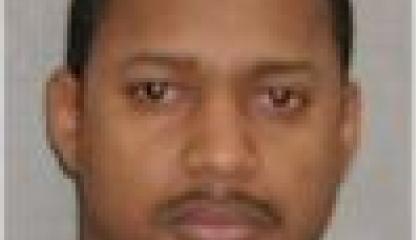 Face photo of male fugitive George Berrios