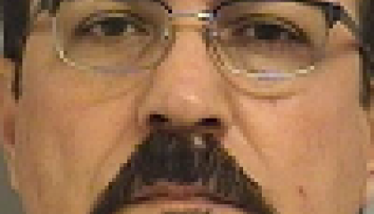 Face photo of male fugitive Barzak Yahya