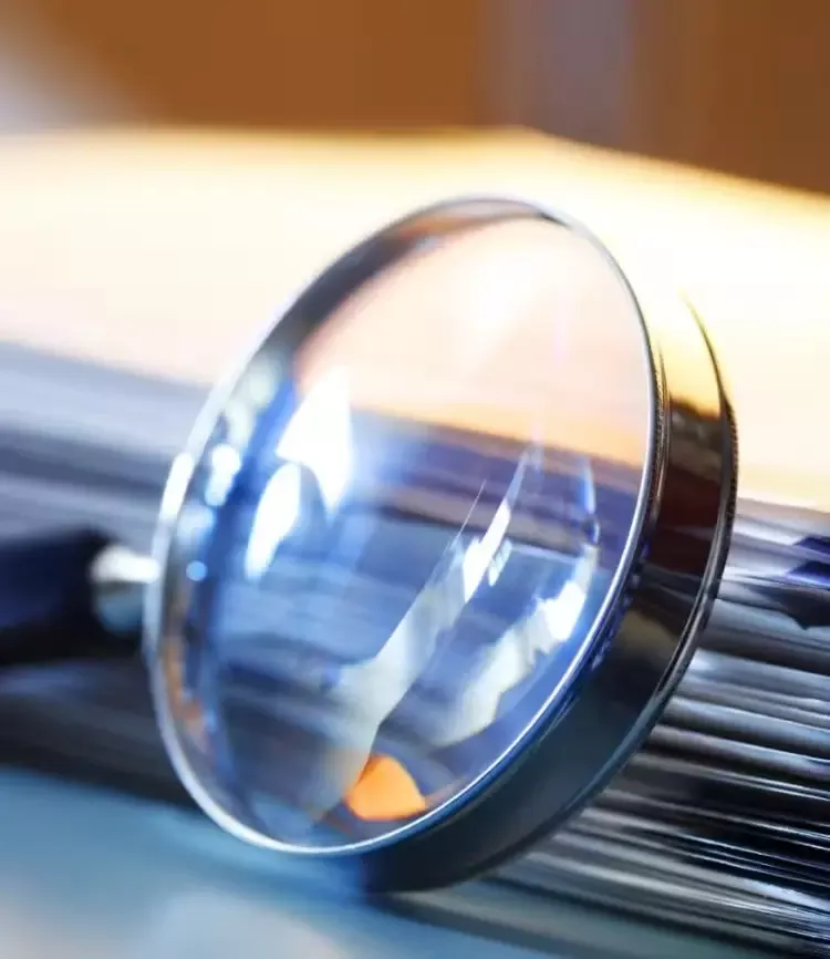 A magnifier and some newspaper
